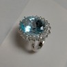 Anello a Cestino in Argento con giro Zirconi e centrale Topazio Azzurro